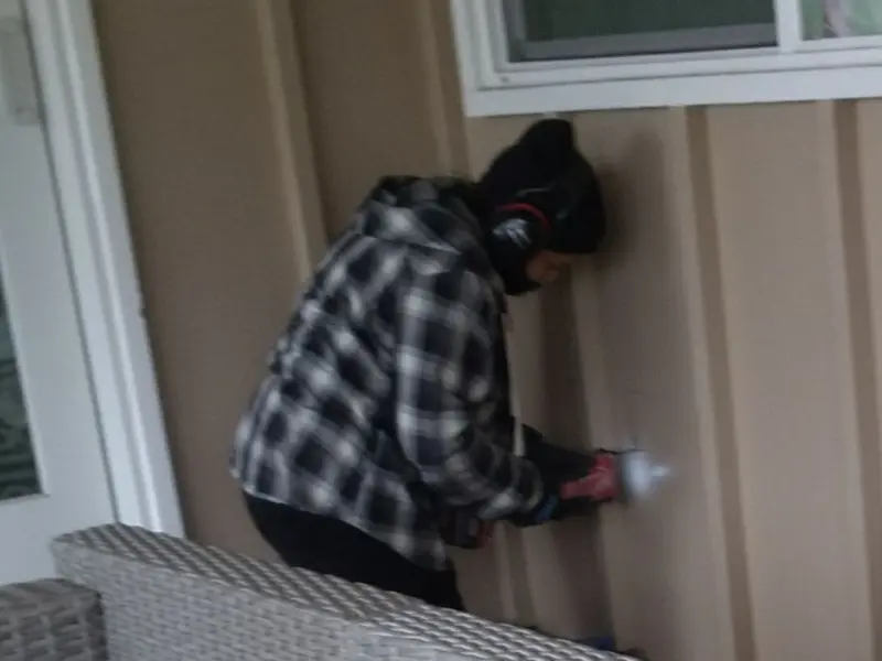 Professional electrician installing an exterior outlet in Pleasant View